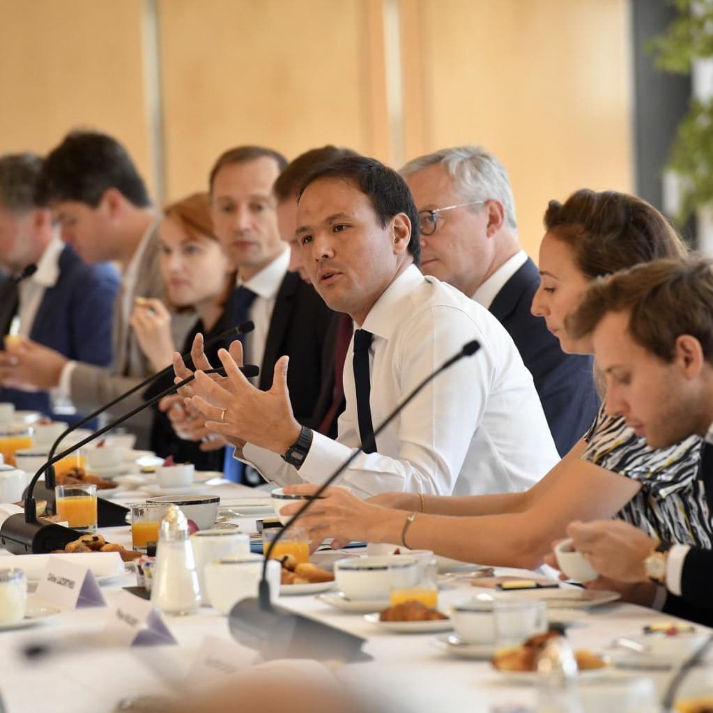 Man speaking at dinner table